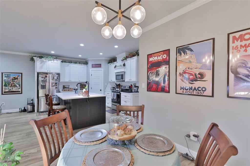 7329 Mountain View Road Abilene, TX 79602 - Photo 15 of 33 a dining room with furniture and wooden floor