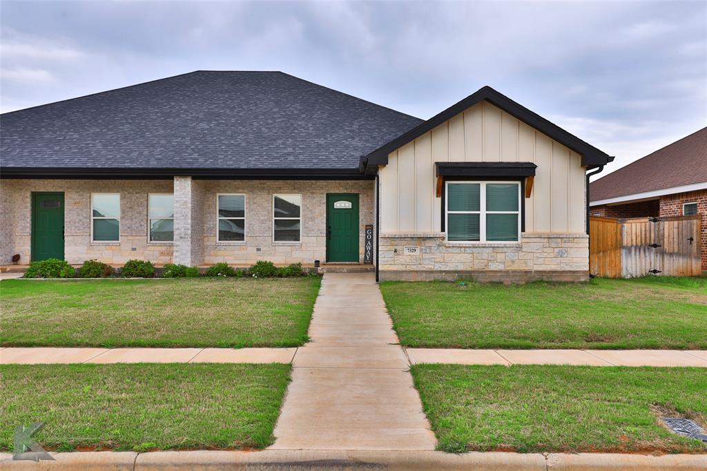 7329 Mountain View Road Abilene, TX 79602 - Photo 2 of 33 a front view of a house with a yard and garage
