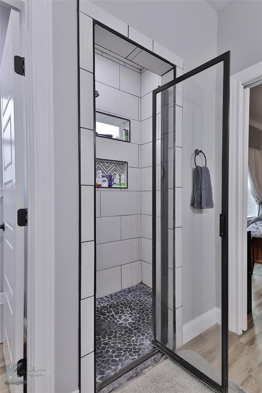 7329 Mountain View Road Abilene, TX 79602 - Photo 21 of 33 a bathroom with a glass shower door