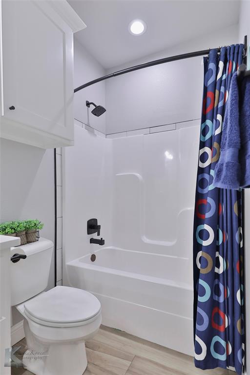 7329 Mountain View Road Abilene, TX 79602 - Photo 27 of 33 a bathroom with a toilet and a shower