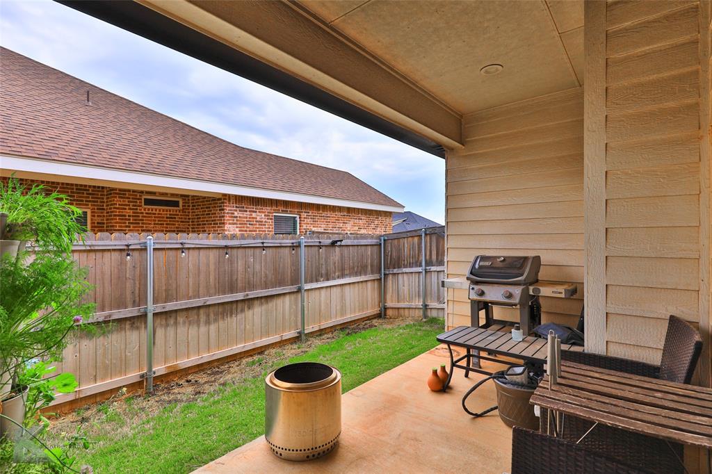 7329 Mountain View Road Abilene, TX 79602 - Photo 30 of 33 a view of a chair and table in backyard of the house