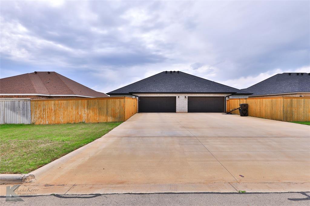 7329 Mountain View Road Abilene, TX 79602 - Photo 33 of 33 a front view of a house with a yard and garage