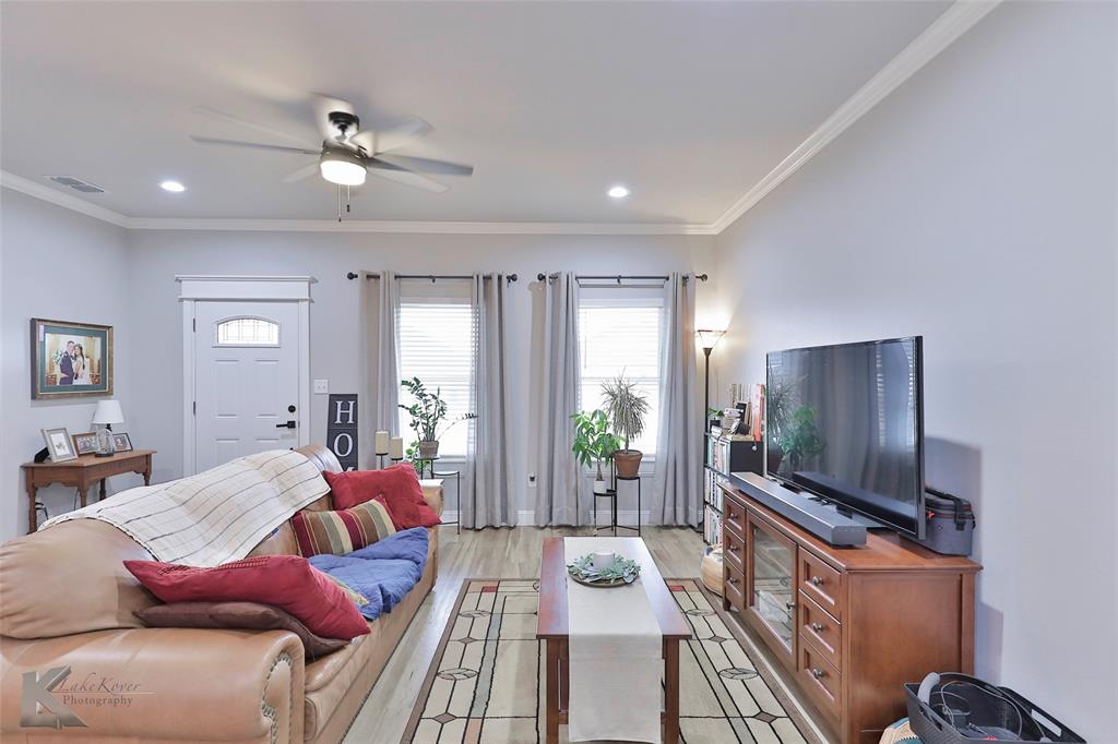 7329 Mountain View Road Abilene, TX 79602 - Photo 5 of 33 a living room with furniture and a flat screen tv