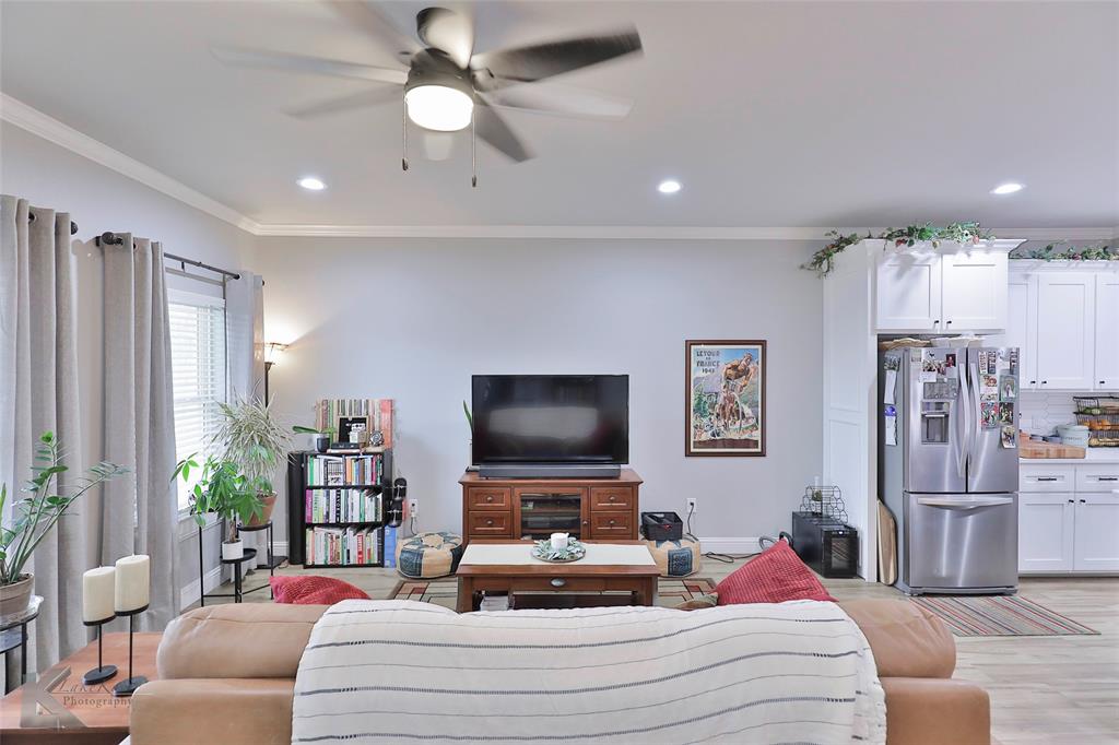 7329 Mountain View Road Abilene, TX 79602 - Photo 6 of 33 a living room with furniture and a flat screen tv