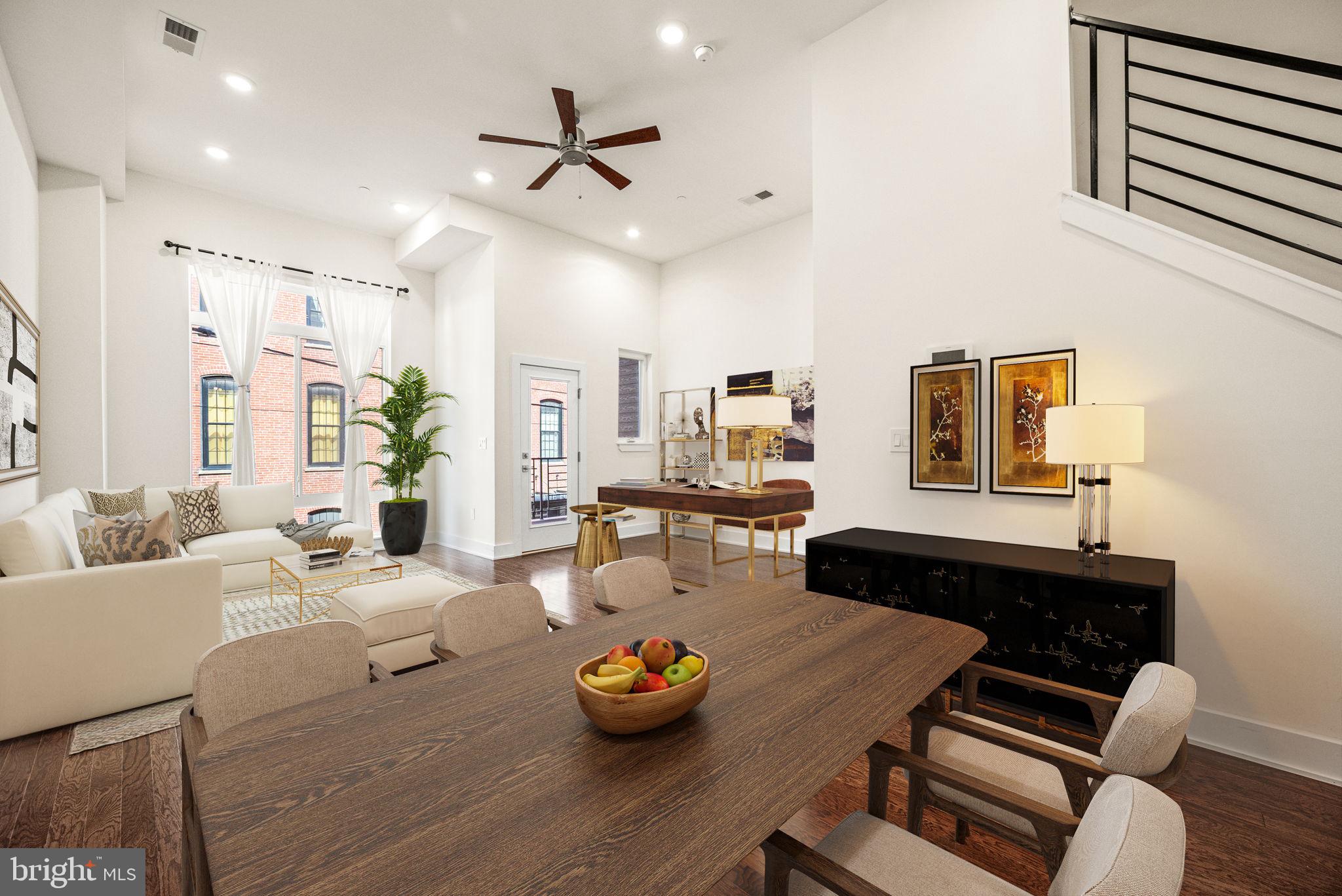 1115 North American Street, Unit D5 Philadelphia, PA 19123 - Photo 1 of 52 a living room with furniture and a wooden floor