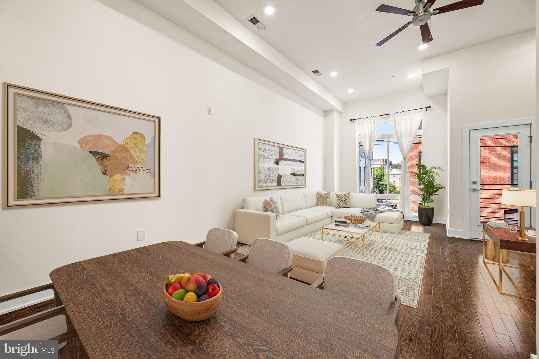 1115 North American Street, Unit D5 Philadelphia, PA 19123 - Photo 16 of 52 a living room with furniture and wooden floor