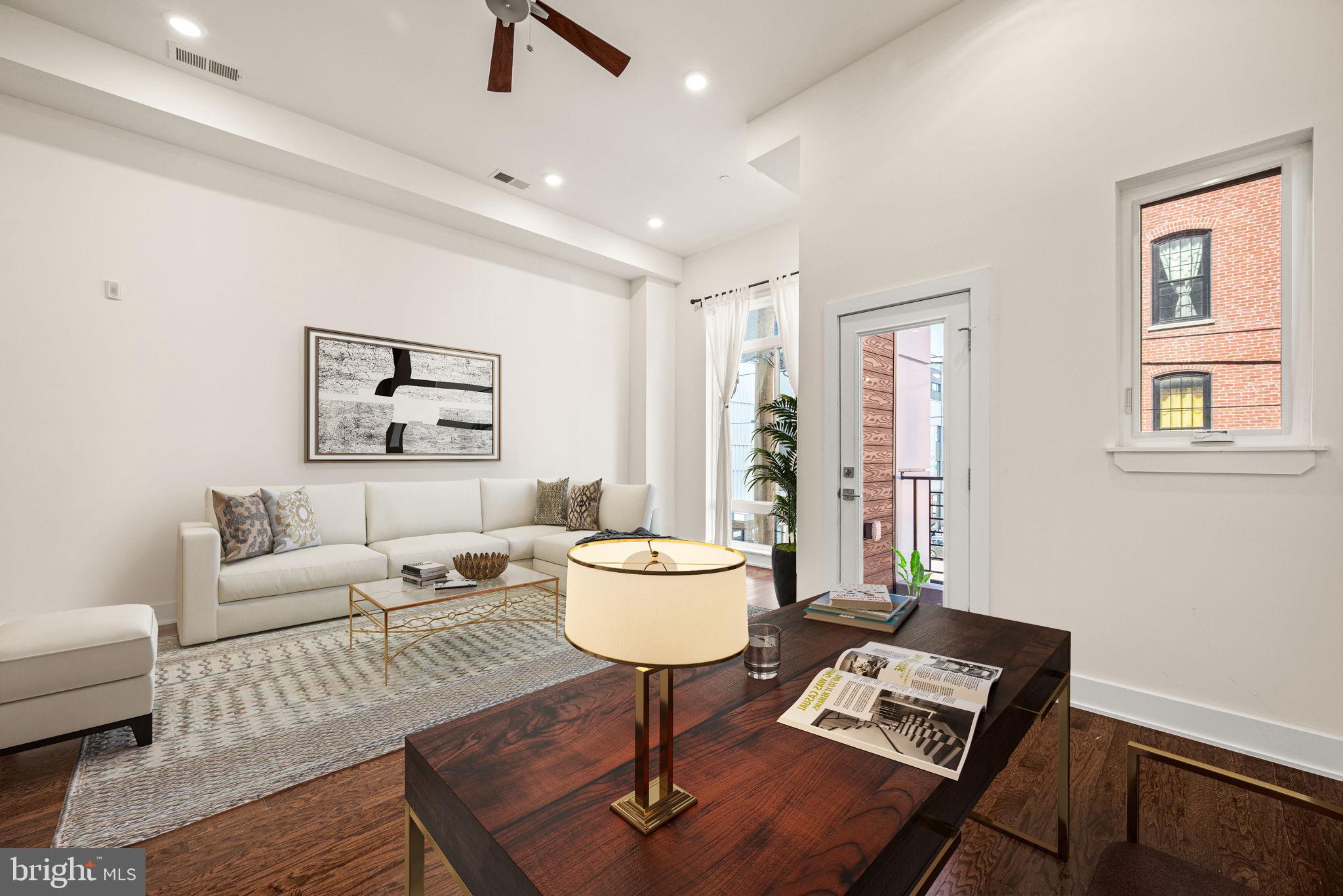 1115 North American Street, Unit D5 Philadelphia, PA 19123 - Photo 18 of 52 a living room with furniture and a window