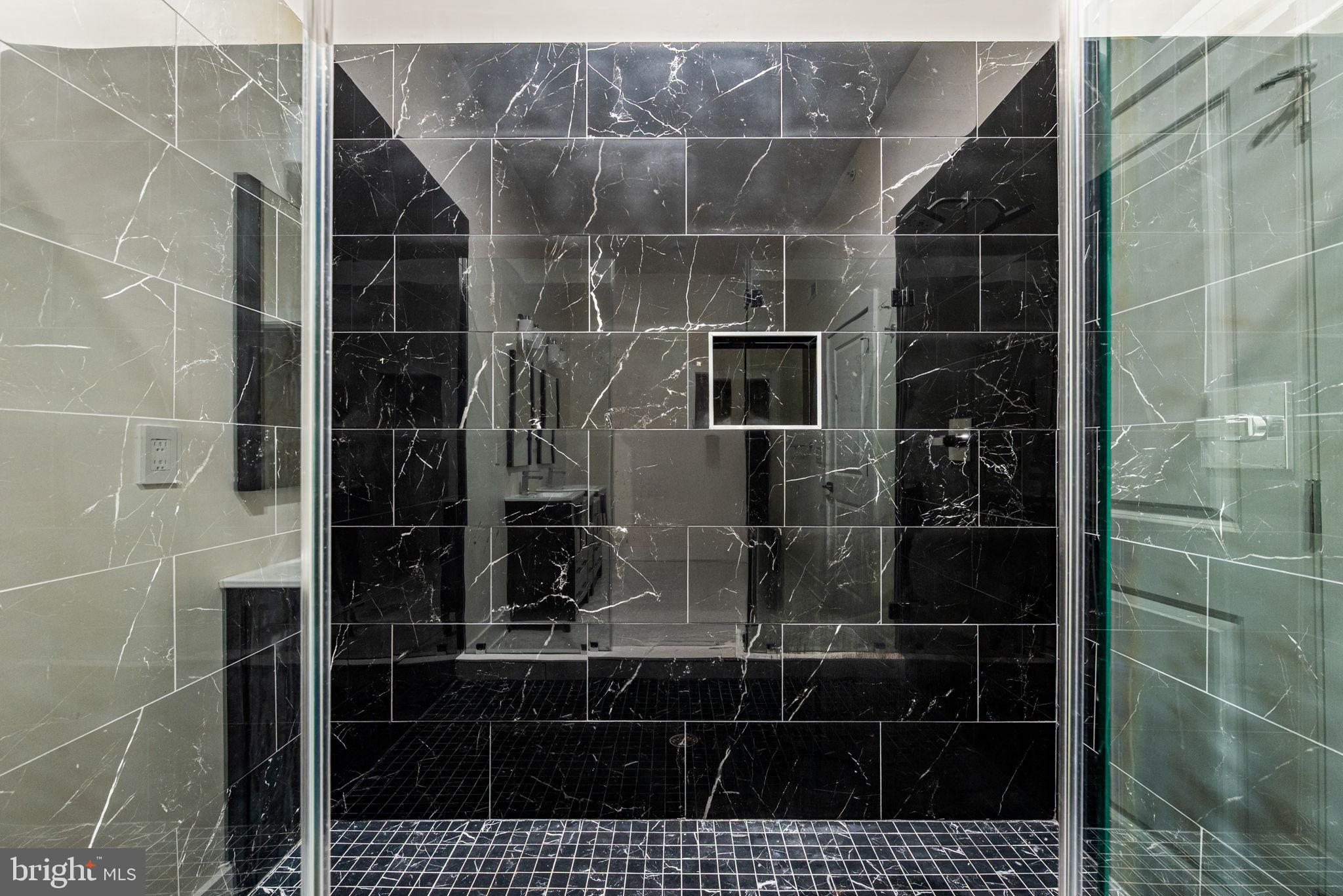 1115 North American Street, Unit D5 Philadelphia, PA 19123 - Photo 41 of 52 a bathroom with a sink and a mirror