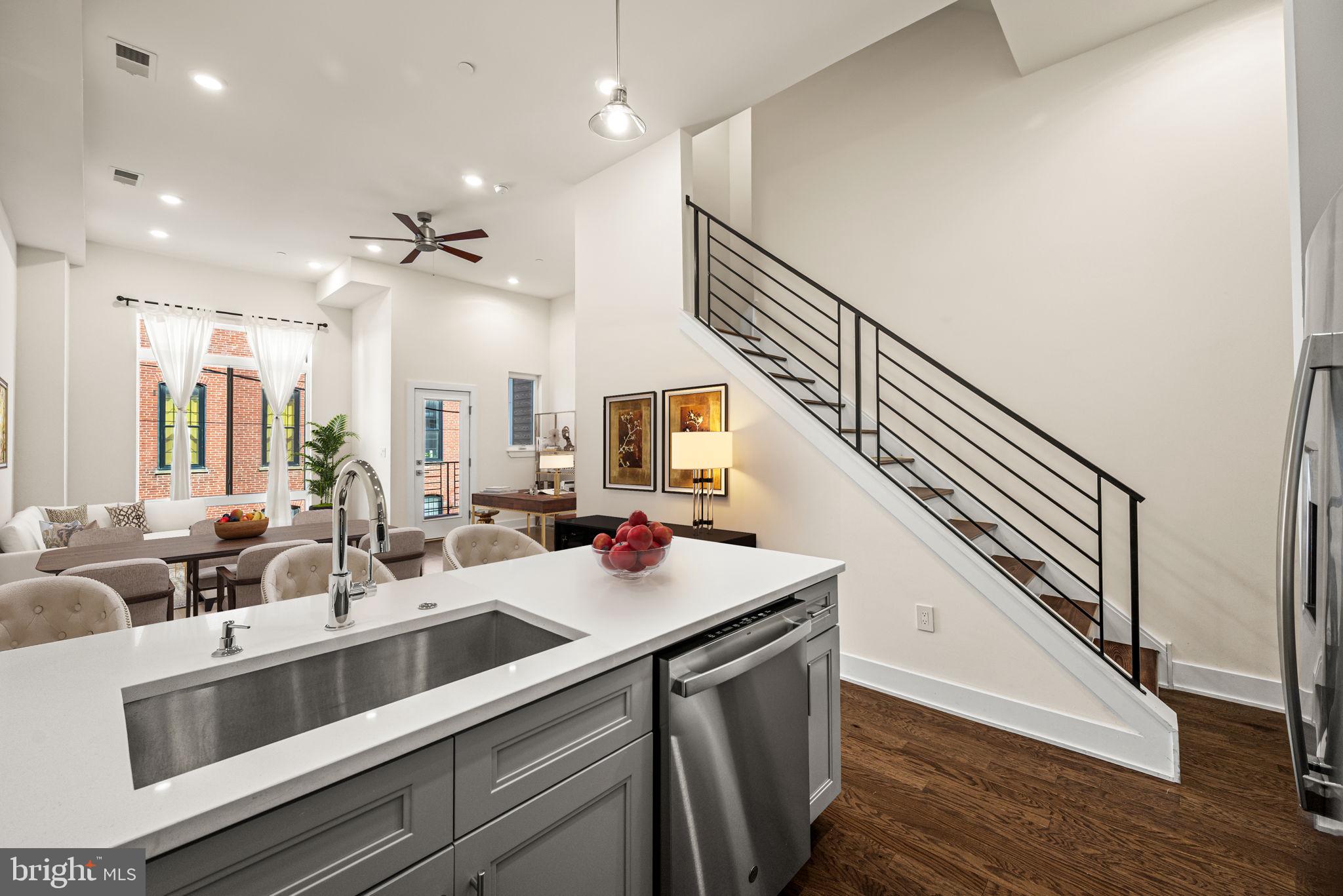 1115 North American Street, Unit D5 Philadelphia, PA 19123 - Photo 5 of 52 a kitchen with sink stove and cabinets