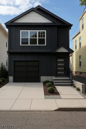 a front view of a house with parking space