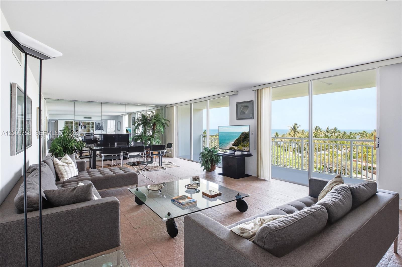 605 Ocean Drive, Unit 7L Key Biscayne, FL 33149 - Photo 1 of 38 a living room with furniture and a large window