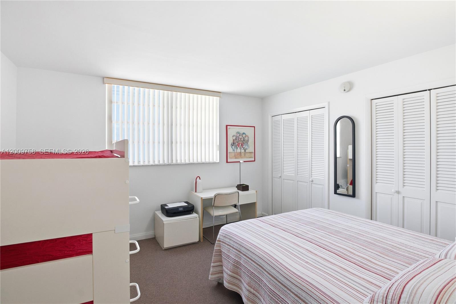 605 Ocean Drive, Unit 7L Key Biscayne, FL 33149 - Photo 12 of 38 a bedroom with a bed and a window