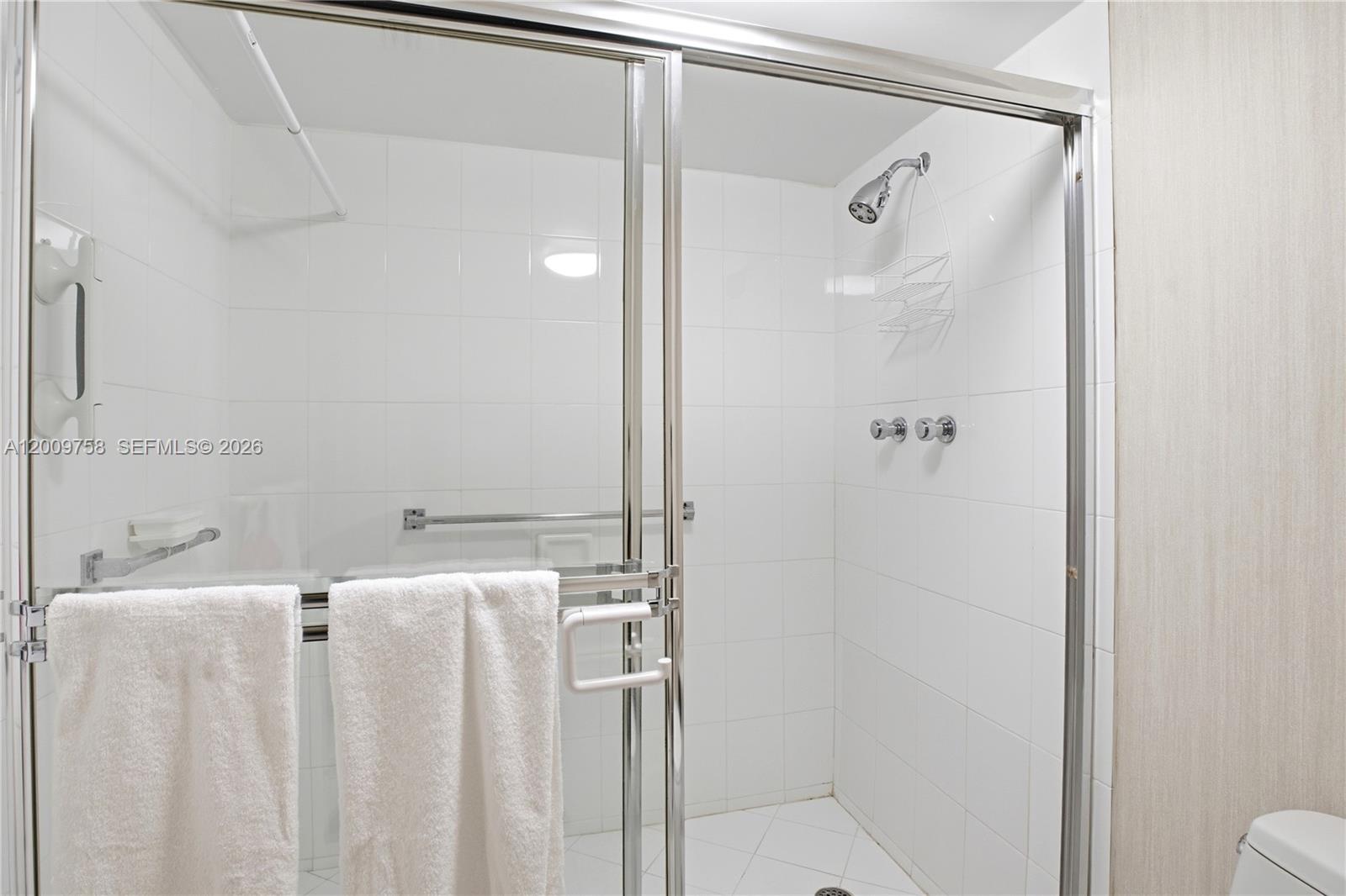 605 Ocean Drive, Unit 7L Key Biscayne, FL 33149 - Photo 19 of 38 a bathroom with a bathtub and shower
