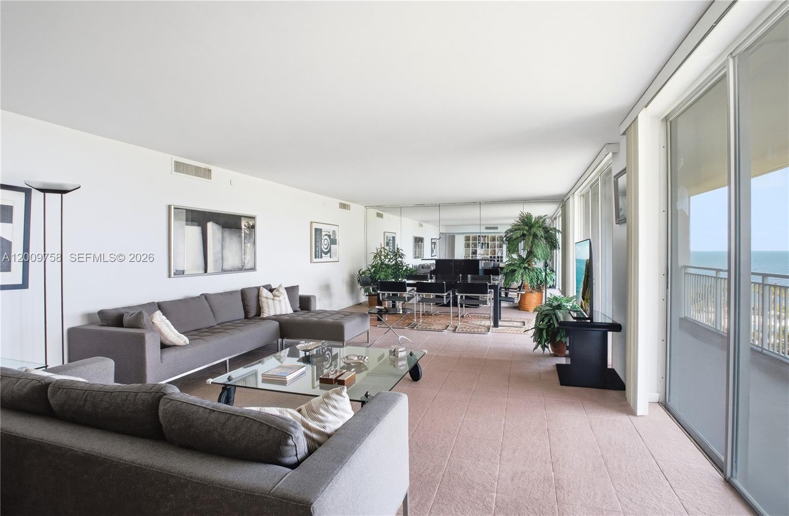 605 Ocean Drive, Unit 7L Key Biscayne, FL 33149 - Photo 2 of 38 a living room with furniture and a large window