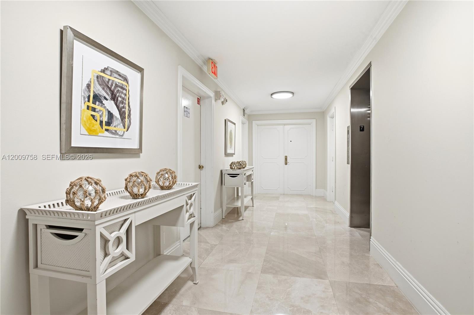 605 Ocean Drive, Unit 7L Key Biscayne, FL 33149 - Photo 23 of 38 a view of an entryway with wooden floor