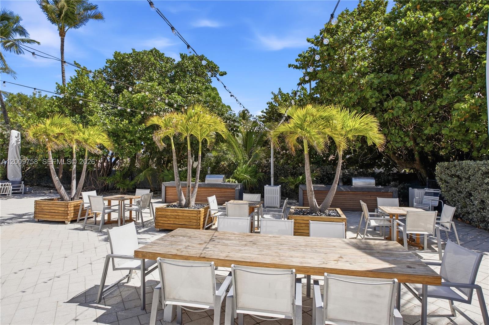 605 Ocean Drive, Unit 7L Key Biscayne, FL 33149 - Photo 24 of 38 a view of backyard with swimming pool and patio
