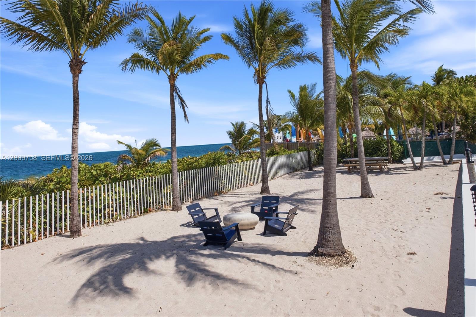 605 Ocean Drive, Unit 7L Key Biscayne, FL 33149 - Photo 26 of 38 a view of a backyard with palm trees