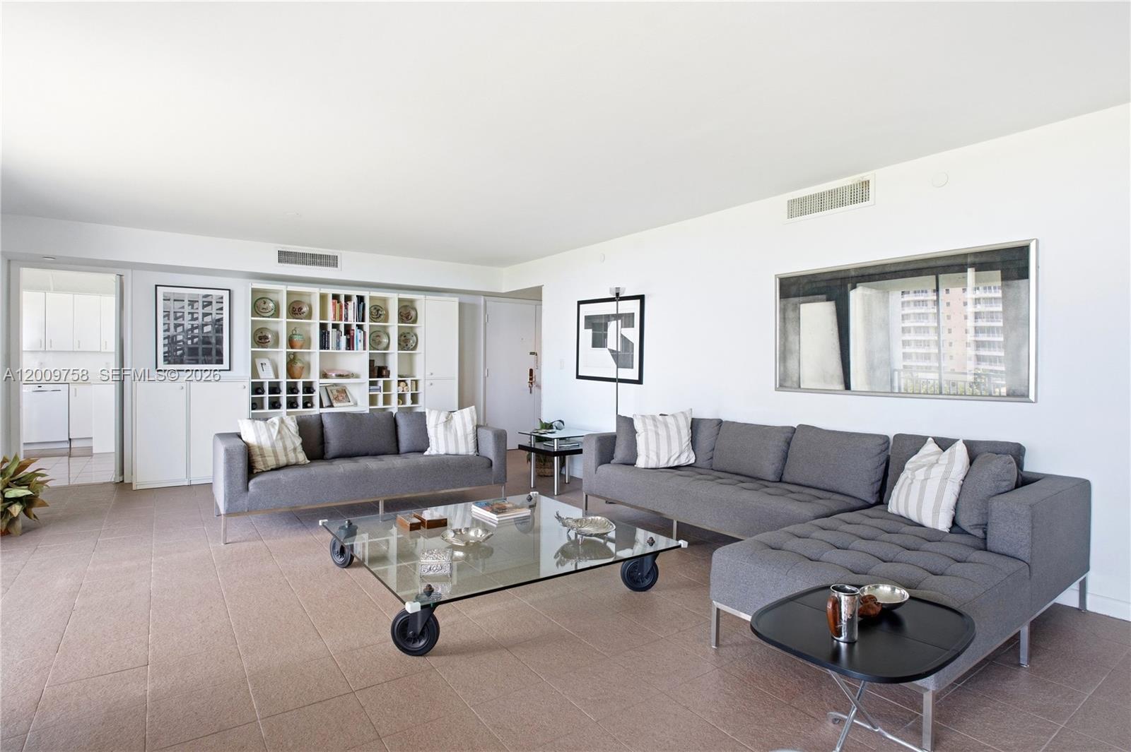 605 Ocean Drive, Unit 7L Key Biscayne, FL 33149 - Photo 3 of 38 a living room with furniture and a window