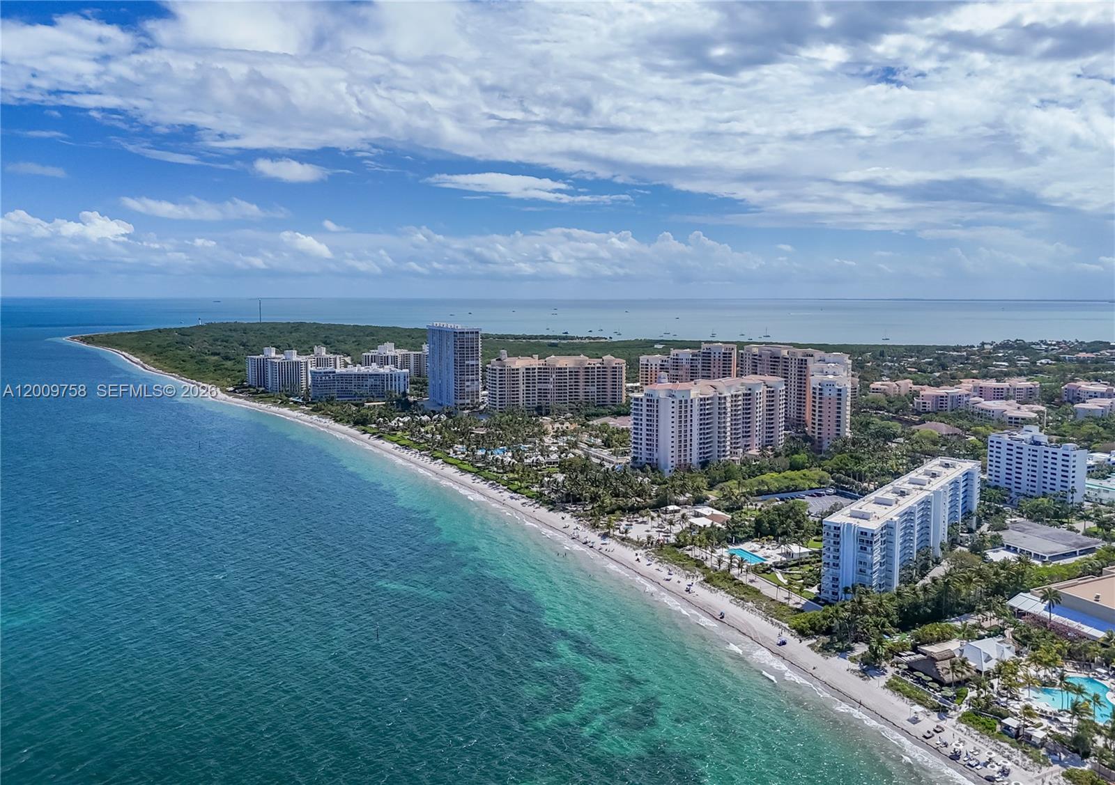 605 Ocean Drive, Unit 7L Key Biscayne, FL 33149 - Photo 34 of 38 a view of a garden with an buildings in the background