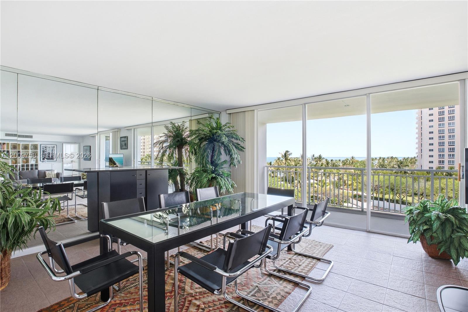 605 Ocean Drive, Unit 7L Key Biscayne, FL 33149 - Photo 4 of 38 a view of a livingroom with furniture and floor to ceiling window