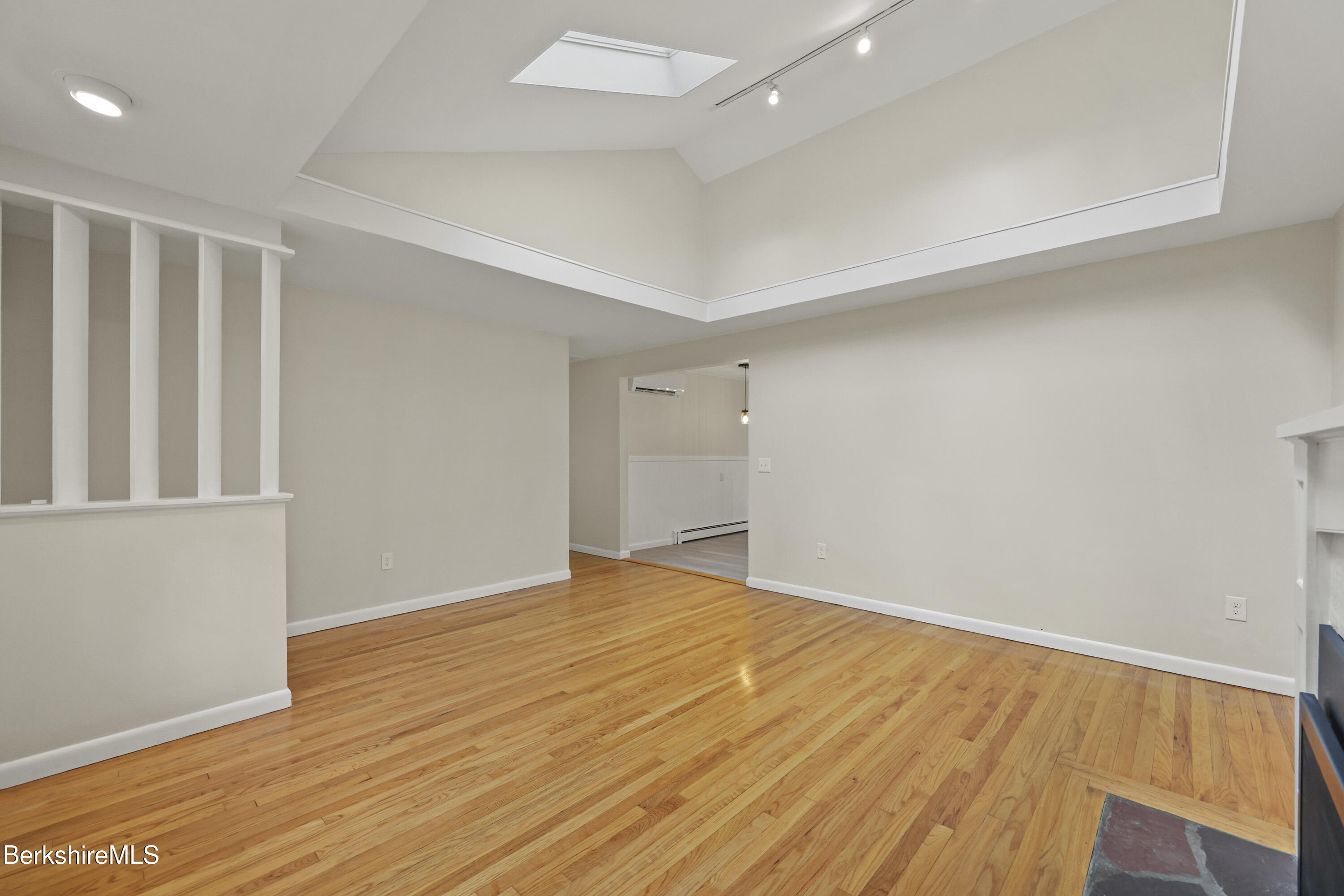627 Lenox Road Richmond, MA 01254 - Photo 13 of 37 a view of an empty room with wooden floor