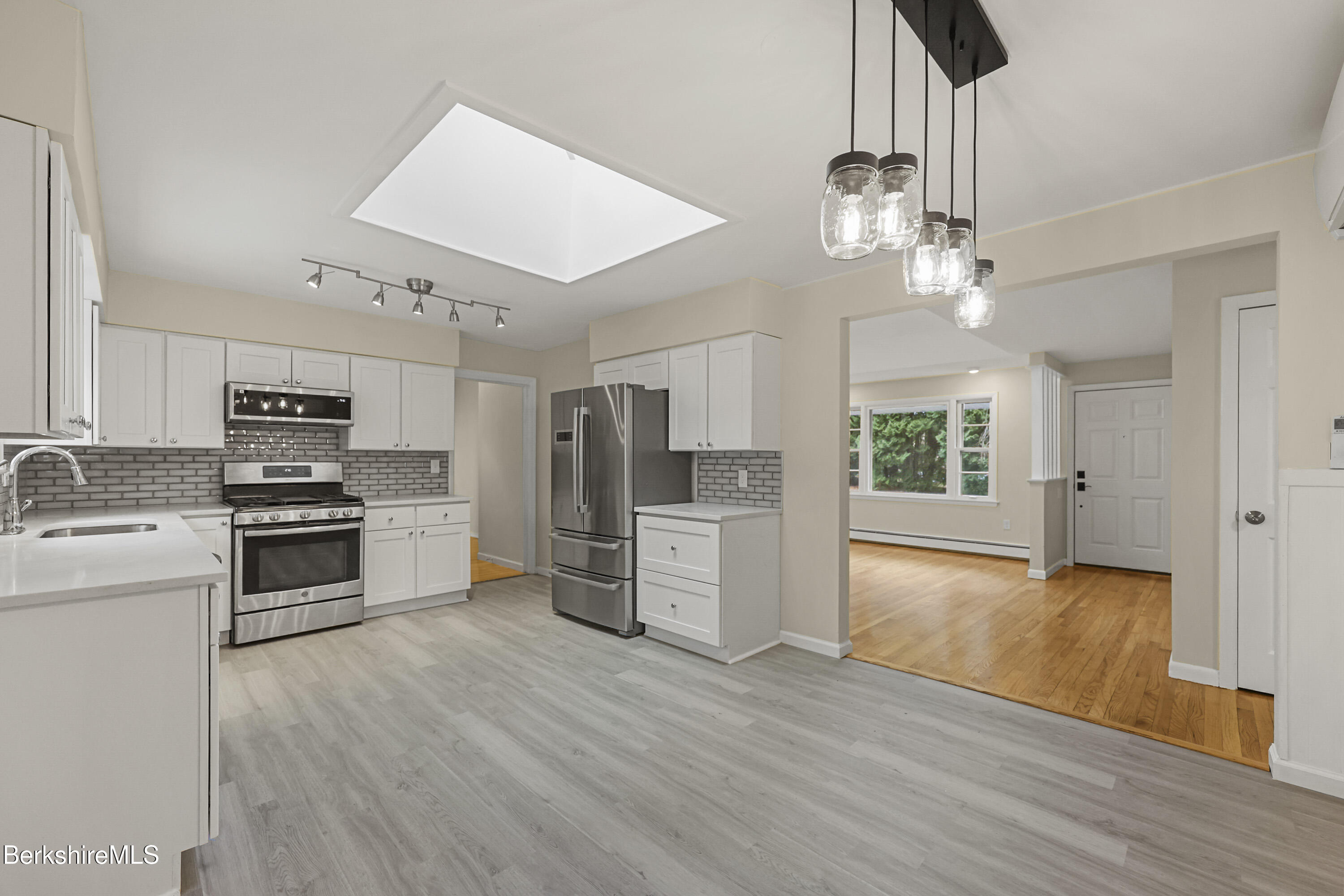 627 Lenox Road Richmond, MA 01254 - Photo 17 of 37 a kitchen with stainless steel appliances a refrigerator and a stove top oven