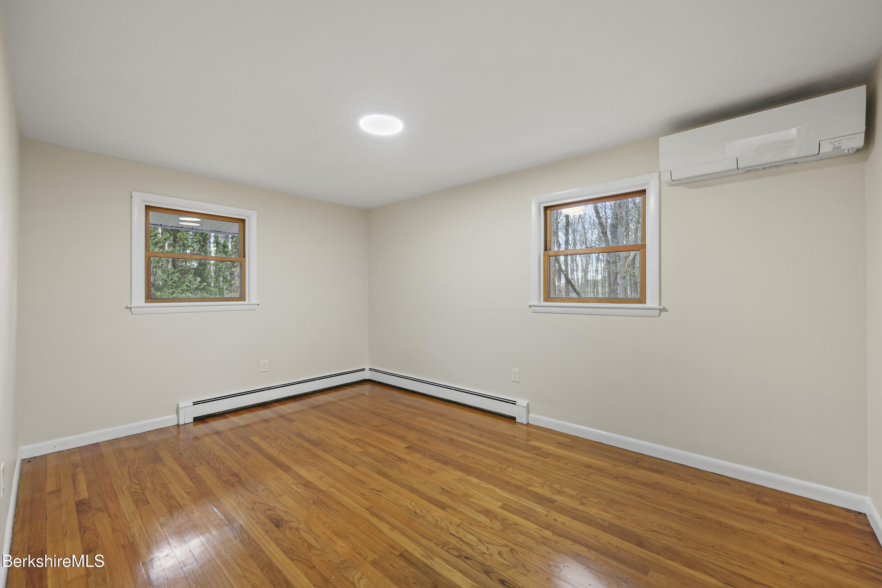 627 Lenox Road Richmond, MA 01254 - Photo 26 of 37 a view of a room with wooden floor and window
