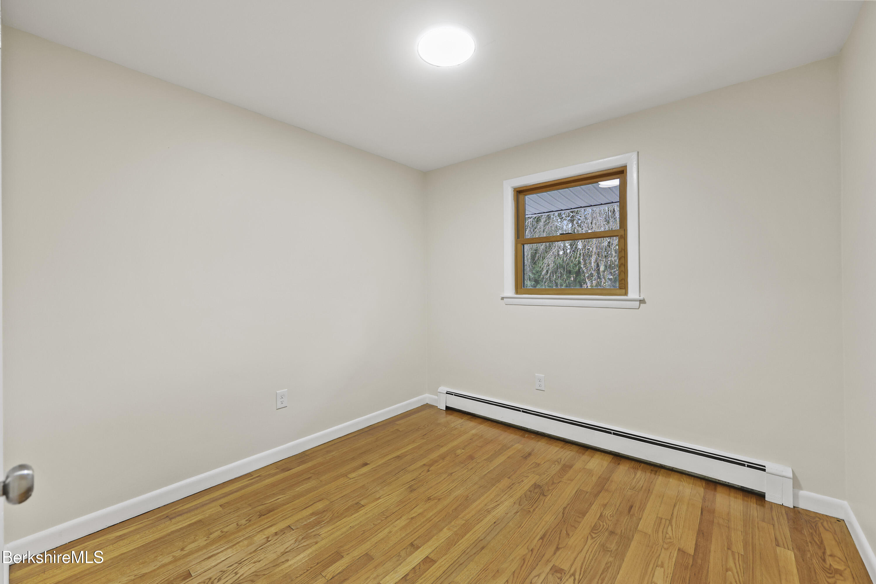 627 Lenox Road Richmond, MA 01254 - Photo 28 of 37 an empty room with a window