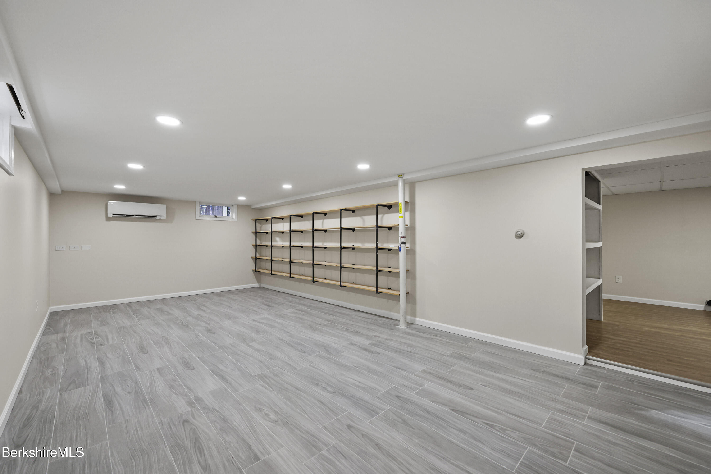 627 Lenox Road Richmond, MA 01254 - Photo 35 of 37 a view of an empty room with wooden floor and closet