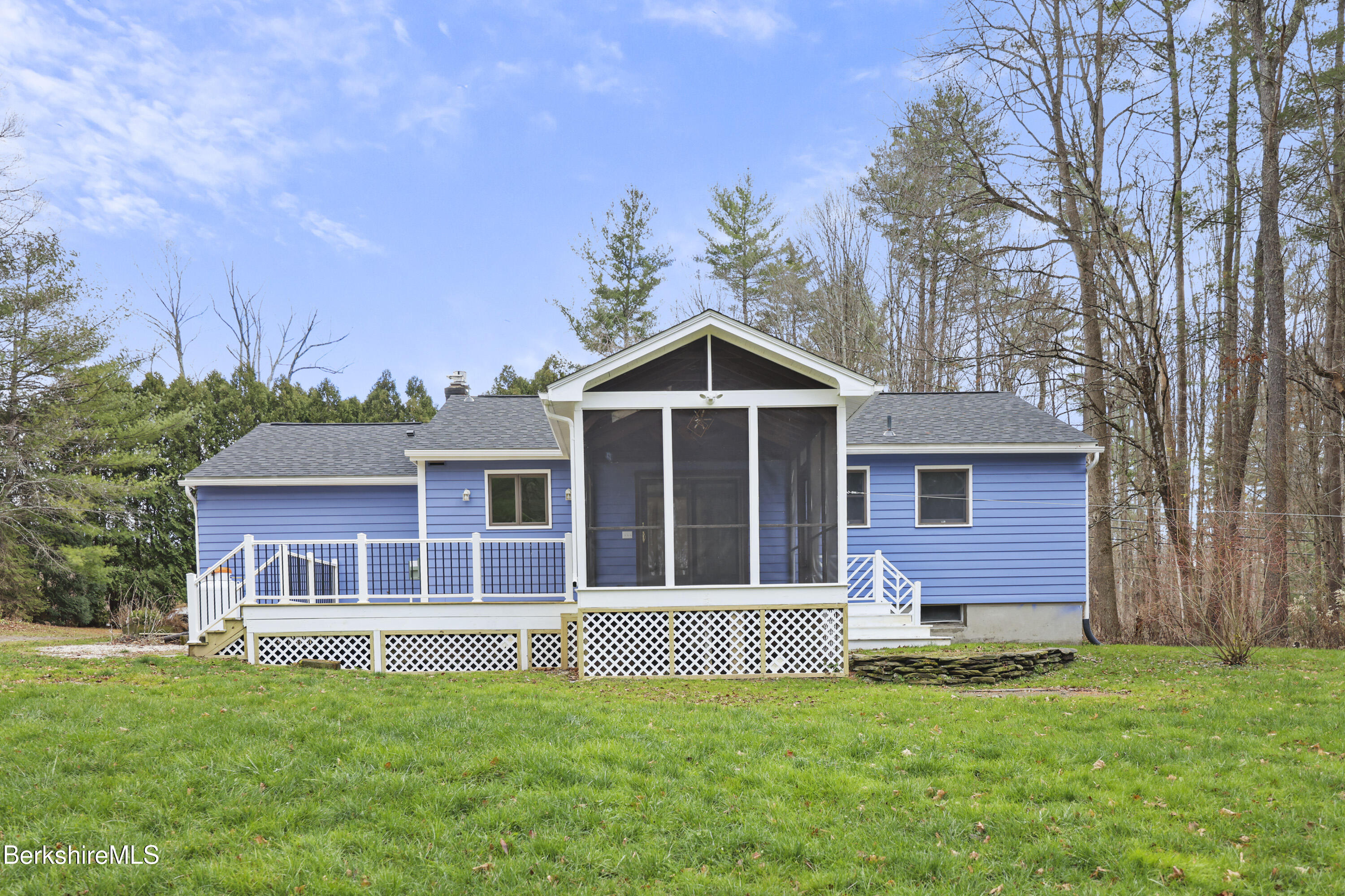 627 Lenox Road Richmond, MA 01254 - Photo 4 of 37 a front view of a house with a garden