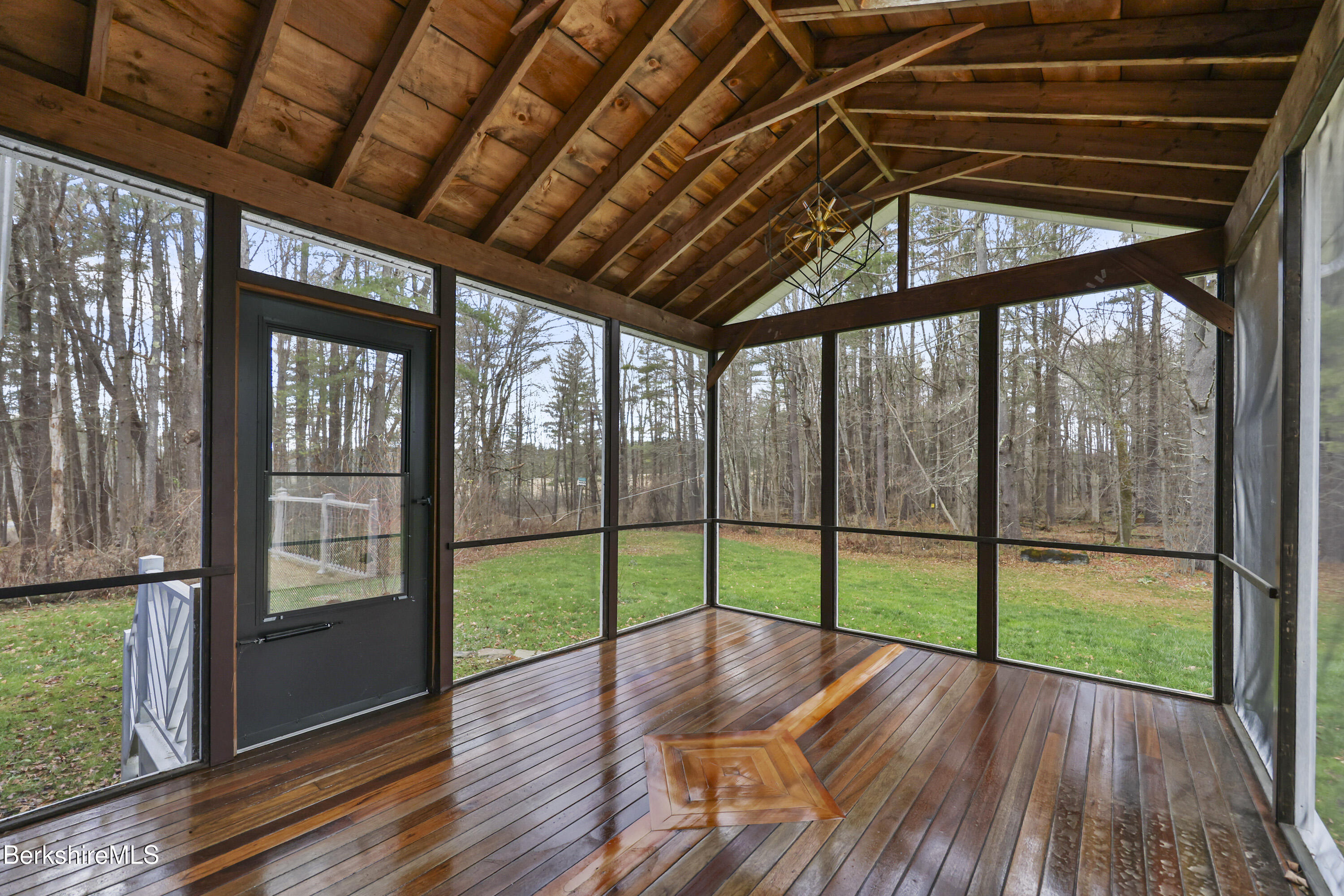627 Lenox Road Richmond, MA 01254 - Photo 8 of 37 a view of empty room with wooden floor and fan