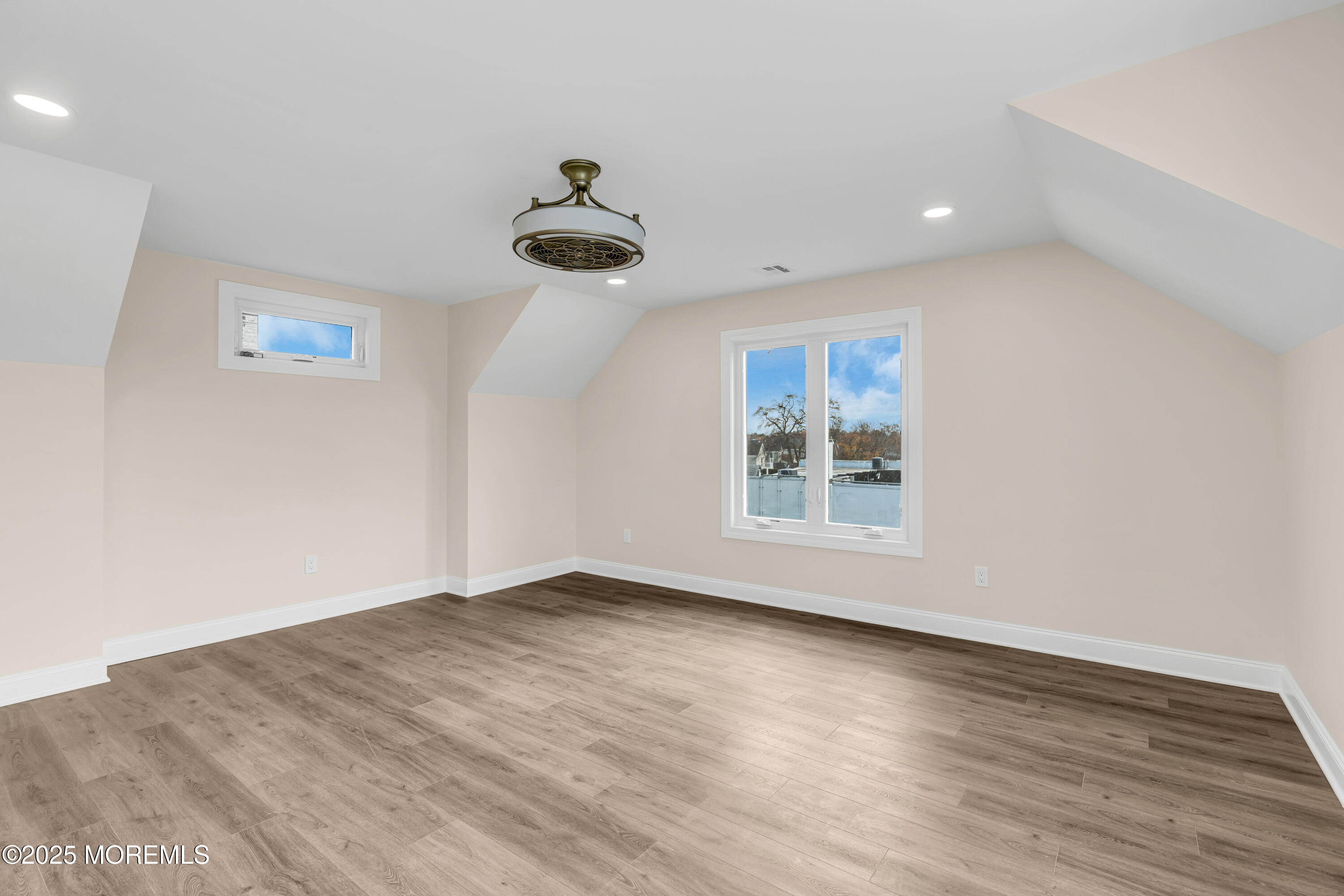 1900 Main Street Belmar, NJ 07719 - Photo 11 of 20 a view of an empty room with a window and wooden floor