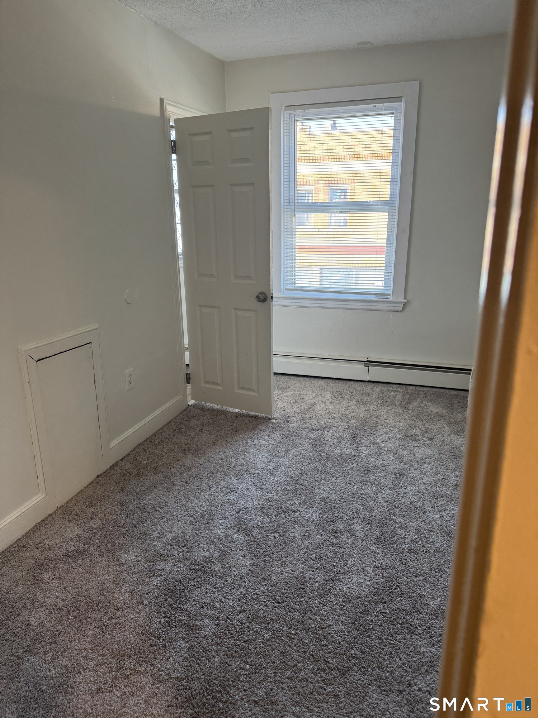 666 Main Street, Unit C2 Middletown, CT 06457 - Photo 5 of 6 a view of an empty room and a window