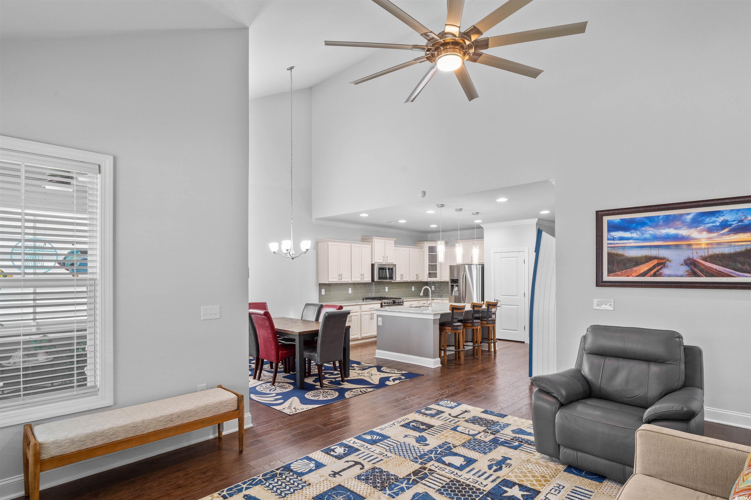 1141 Bronwyn Circle North Myrtle Beach, SC 29582 - Photo 15 of 40 Living room with a chandelier, dark wood-style floors, ceiling fan, and high vaulted ceiling