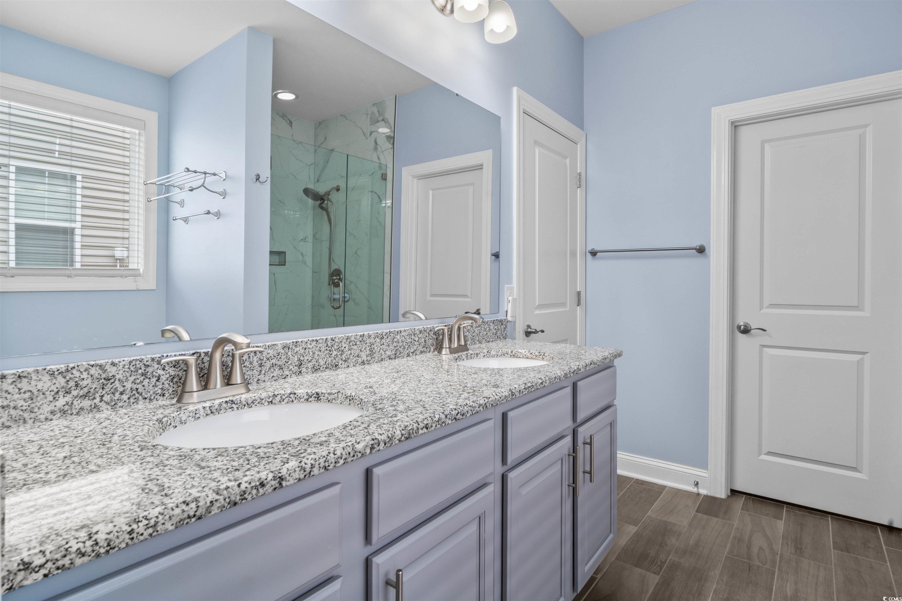 1141 Bronwyn Circle North Myrtle Beach, SC 29582 - Photo 20 of 40 Bathroom with a marble finish shower, double vanity, and wood finish floors