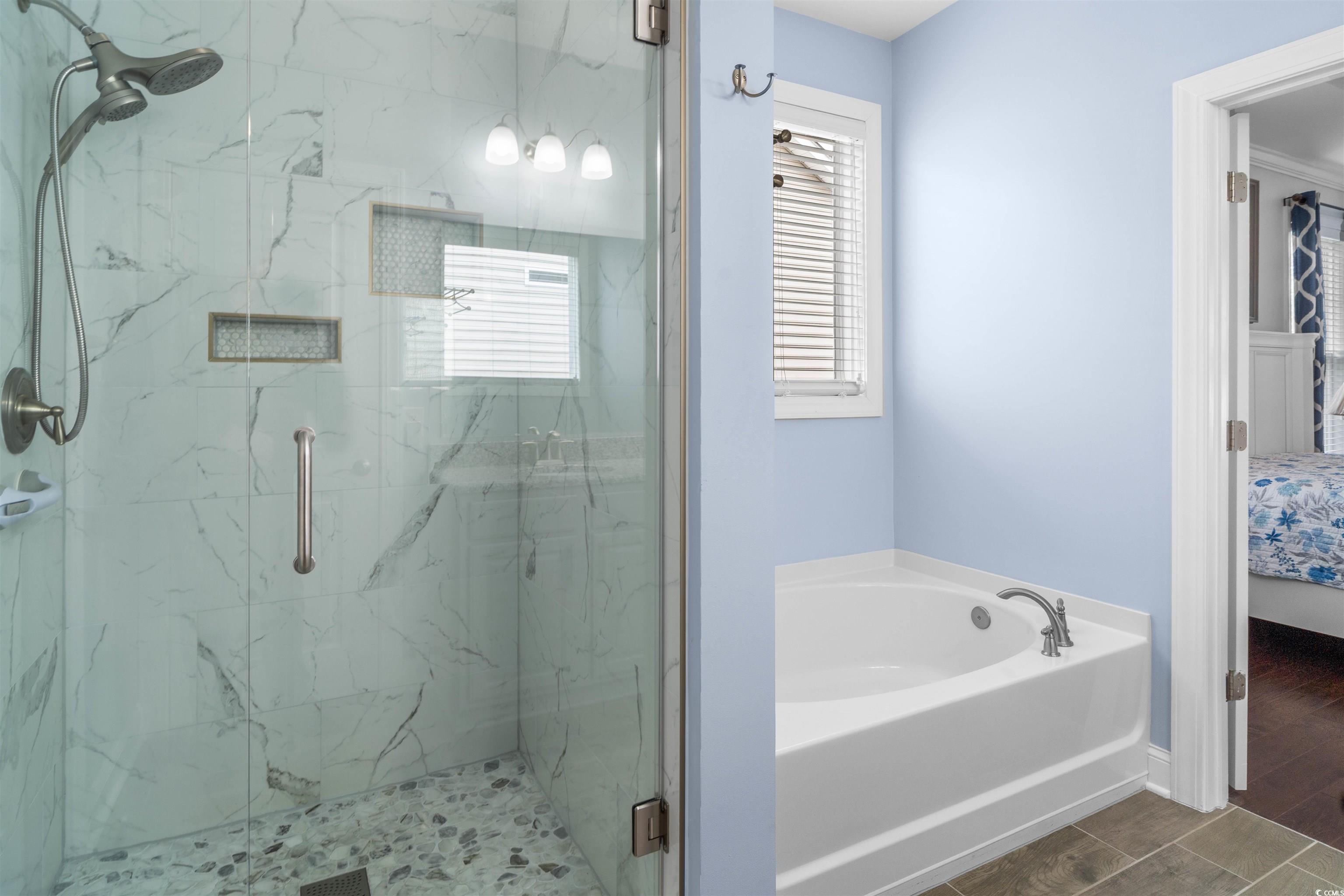 1141 Bronwyn Circle North Myrtle Beach, SC 29582 - Photo 21 of 40 Bathroom featuring connected bathroom, healthy amount of natural light, a garden tub, and a marble finish shower