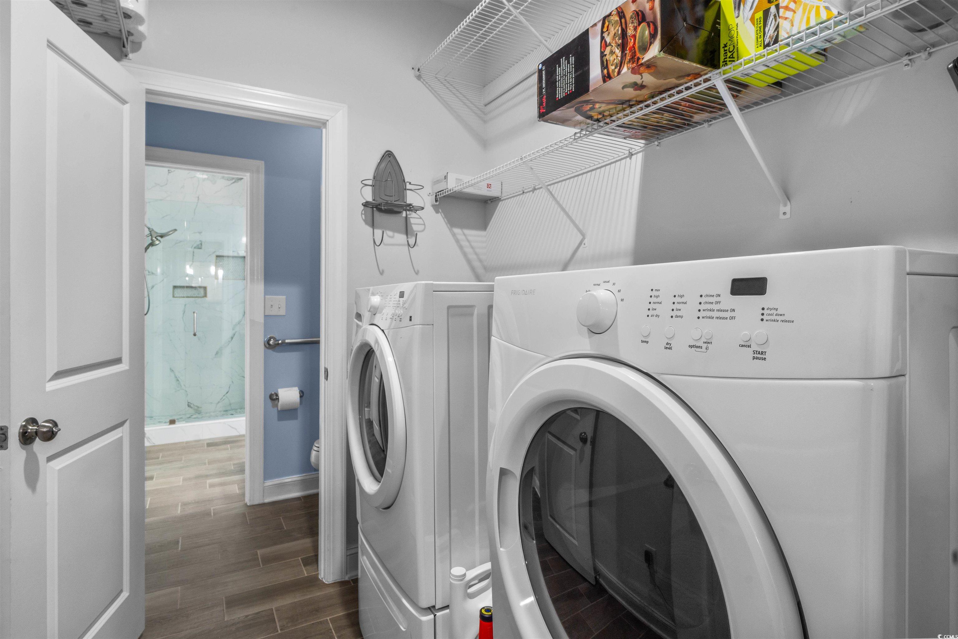 1141 Bronwyn Circle North Myrtle Beach, SC 29582 - Photo 22 of 40 Laundry room featuring wood finish tile with entry to the kitchen and the Primary Bath for easy access