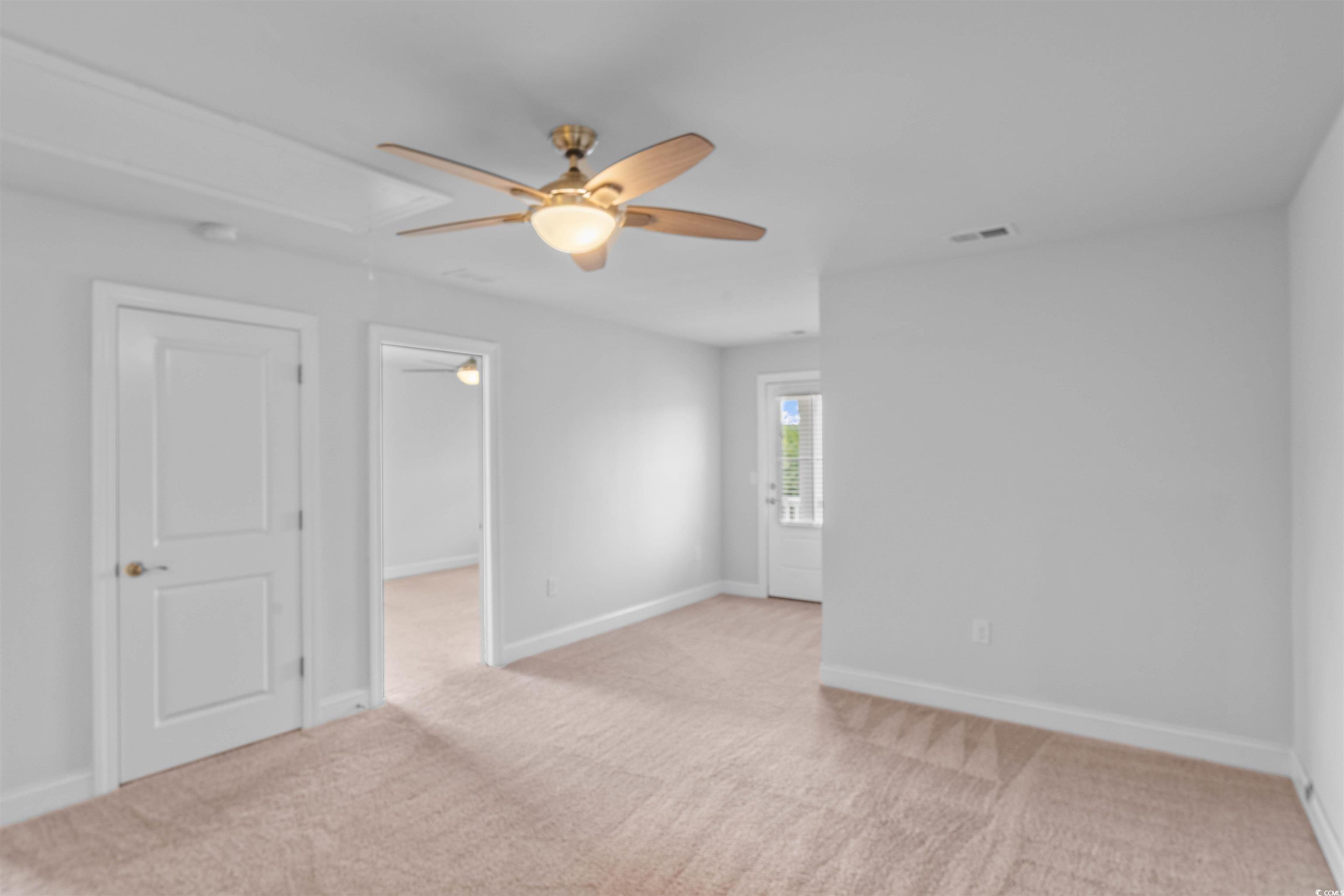 1141 Bronwyn Circle North Myrtle Beach, SC 29582 - Photo 27 of 40 Empty room featuring light carpet and a ceiling fan