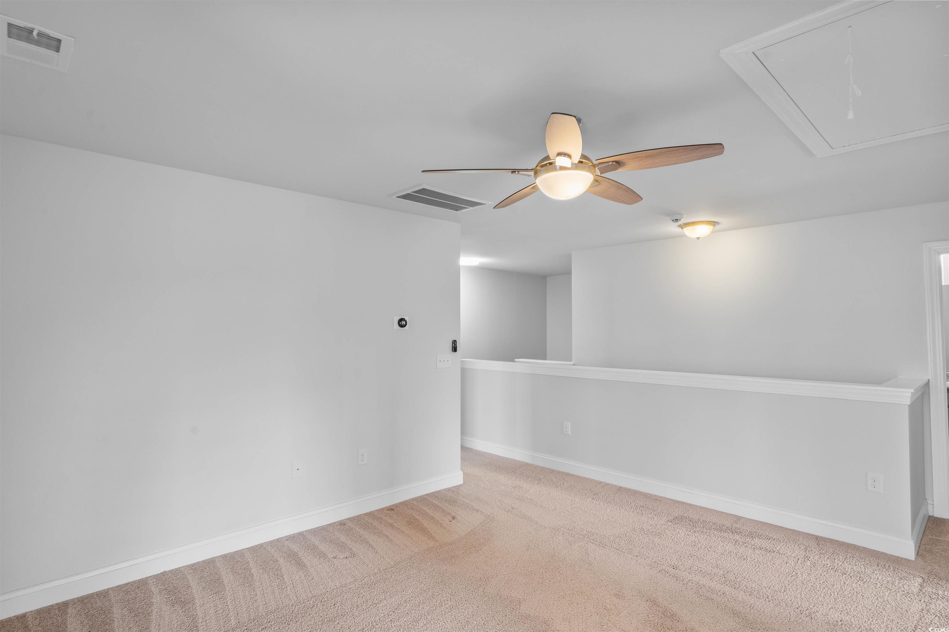 1141 Bronwyn Circle North Myrtle Beach, SC 29582 - Photo 28 of 40 Carpeted spare room featuring attic access and ceiling fan