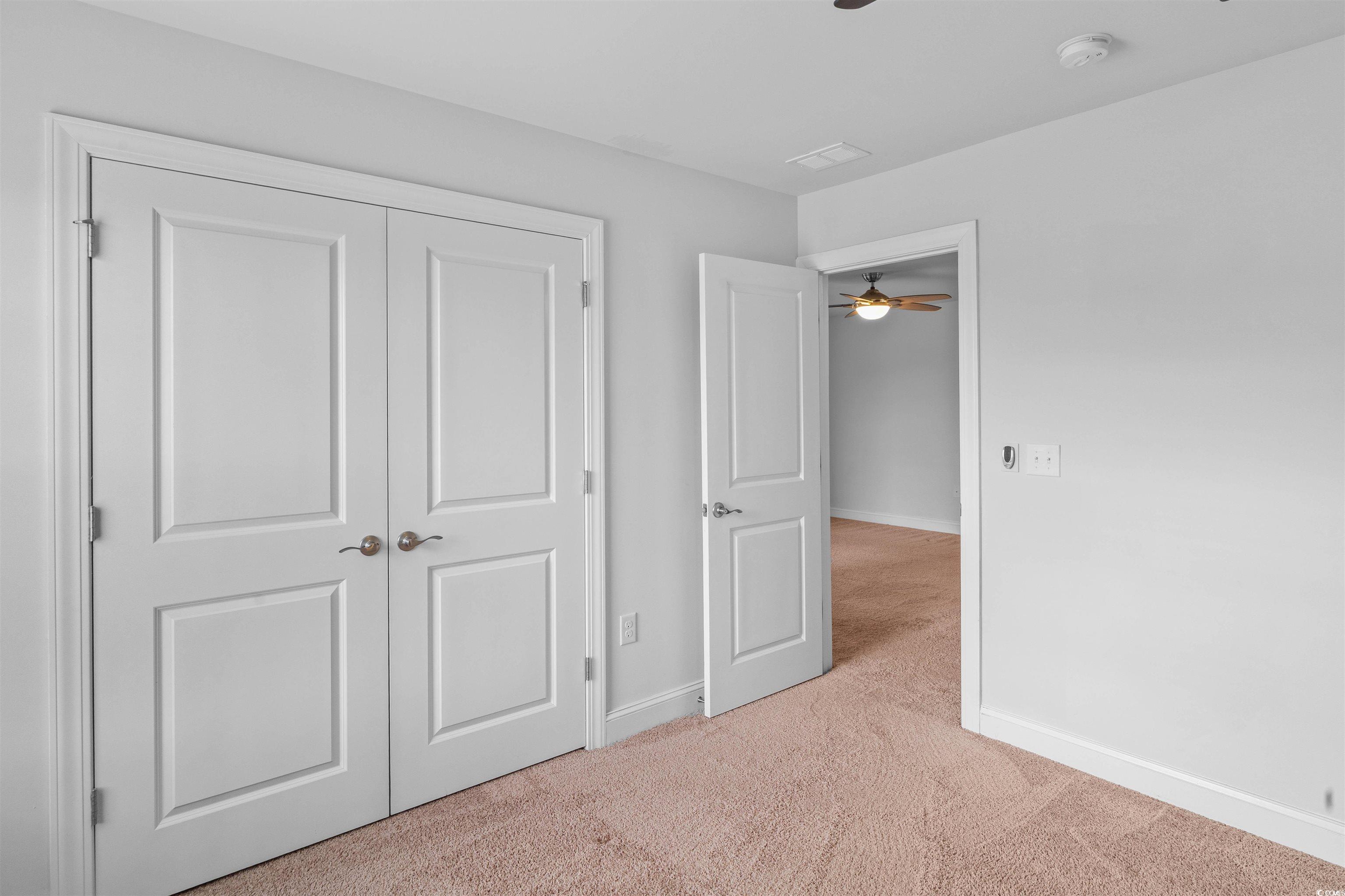 1141 Bronwyn Circle North Myrtle Beach, SC 29582 - Photo 34 of 40 Unfurnished bedroom with light carpet and a closet