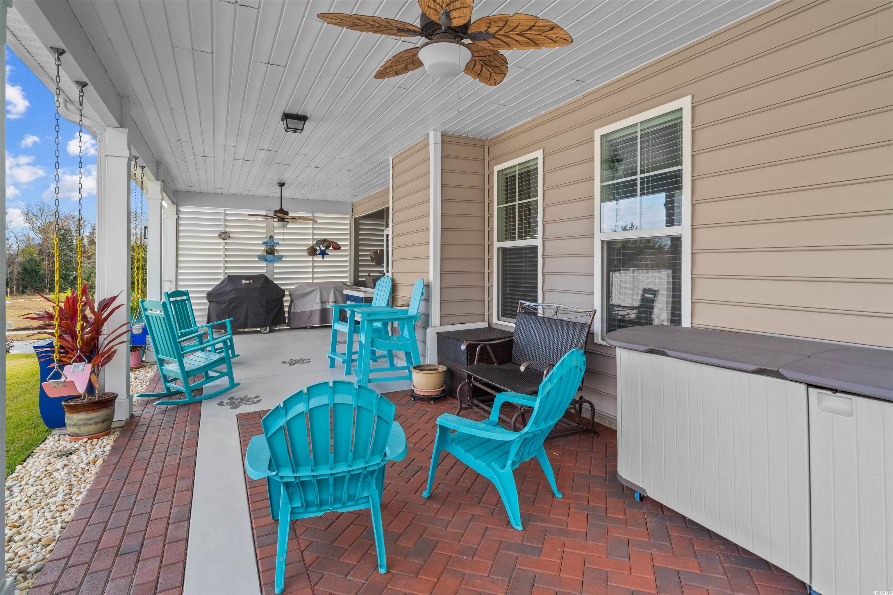 1141 Bronwyn Circle North Myrtle Beach, SC 29582 - Photo 37 of 40 View of patio featuring a ceiling fan, area for grilling, and a hot tub