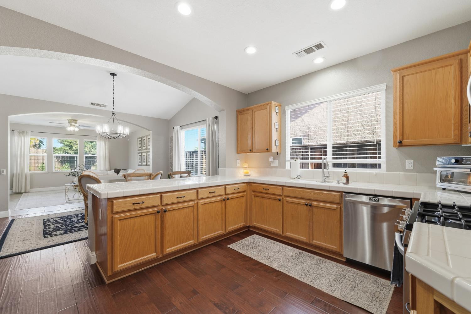 2220 Ellison Drive Modesto, CA 95355 - Photo 10 of 53 a large kitchen with stainless steel appliances granite countertop a stove and a sink