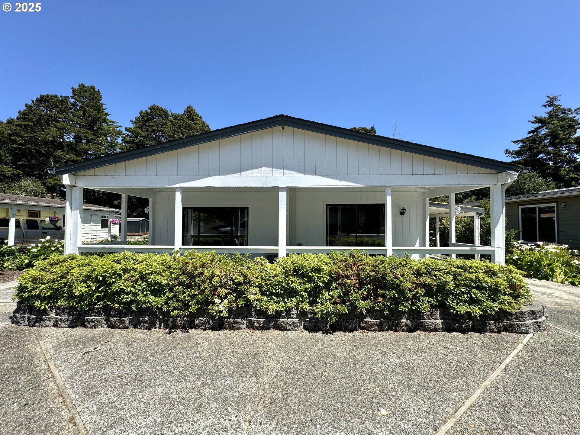 1601 Rhododendron Drive, Unit 676 Florence, OR 97439 - Photo 2 of 36 front view of a house with a small yard