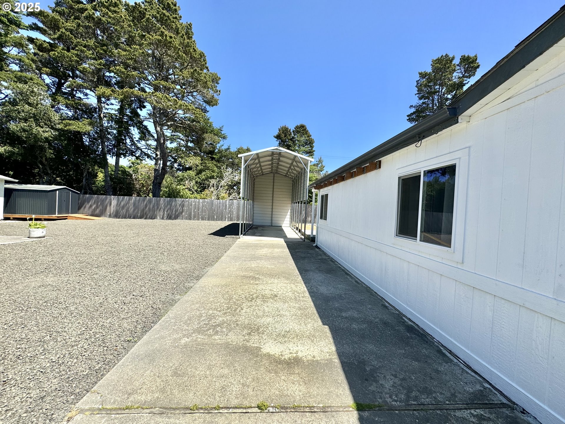 1601 Rhododendron Drive, Unit 676 Florence, OR 97439 - Photo 29 of 36 a view of a house with a yard