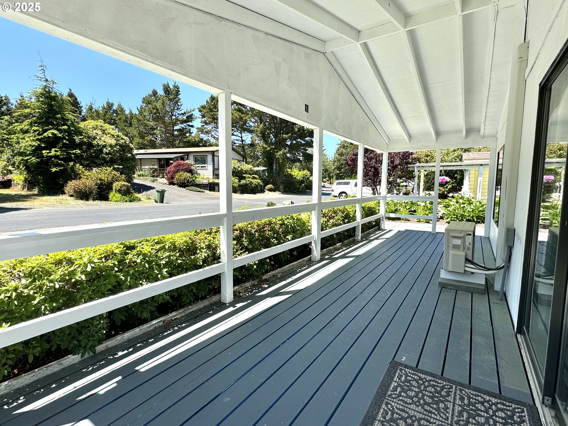 1601 Rhododendron Drive, Unit 676 Florence, OR 97439 - Photo 35 of 36 a view of a balcony with yard