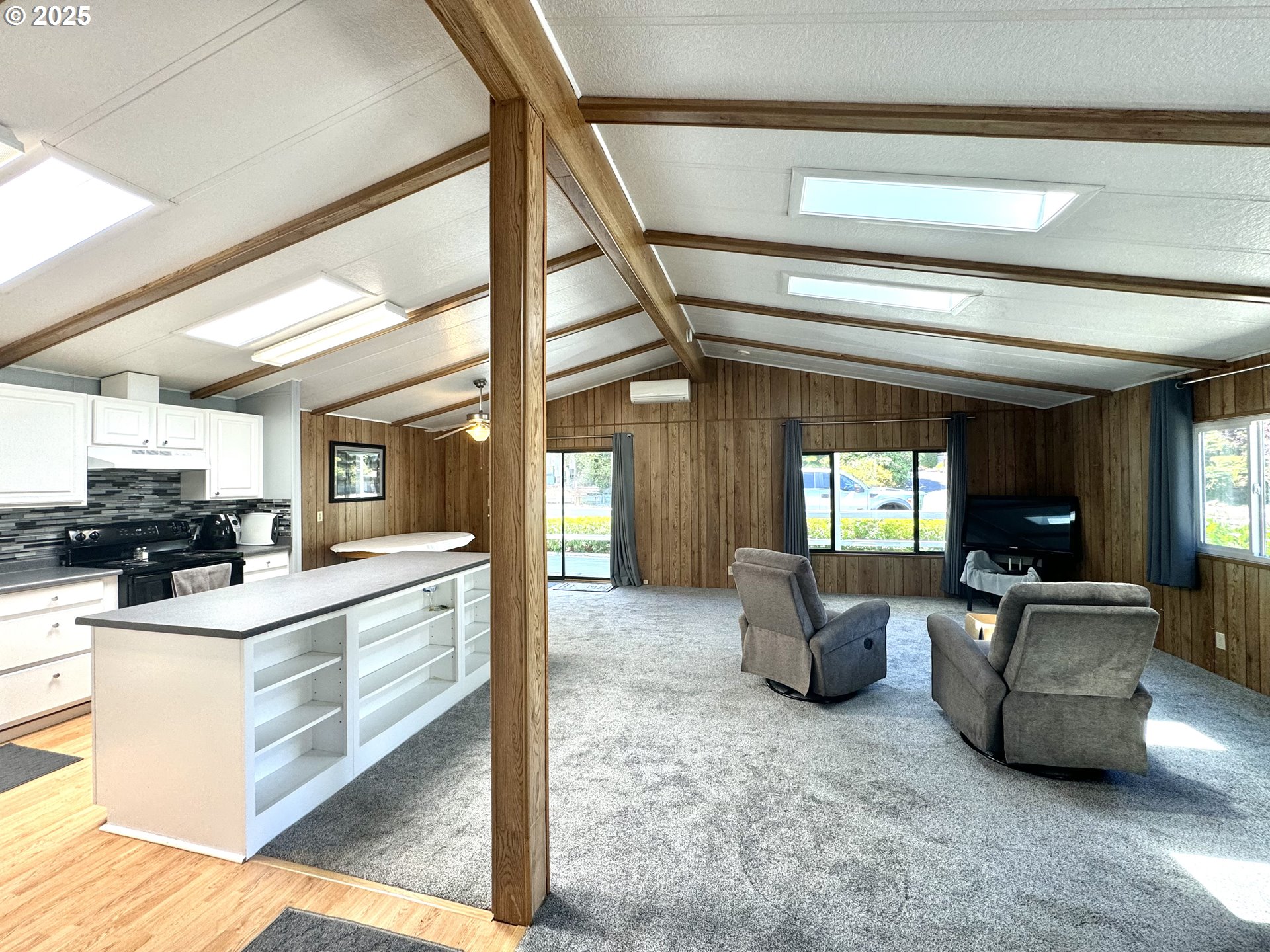 1601 Rhododendron Drive, Unit 676 Florence, OR 97439 - Photo 6 of 36 a kitchen with a sink and a stove top oven