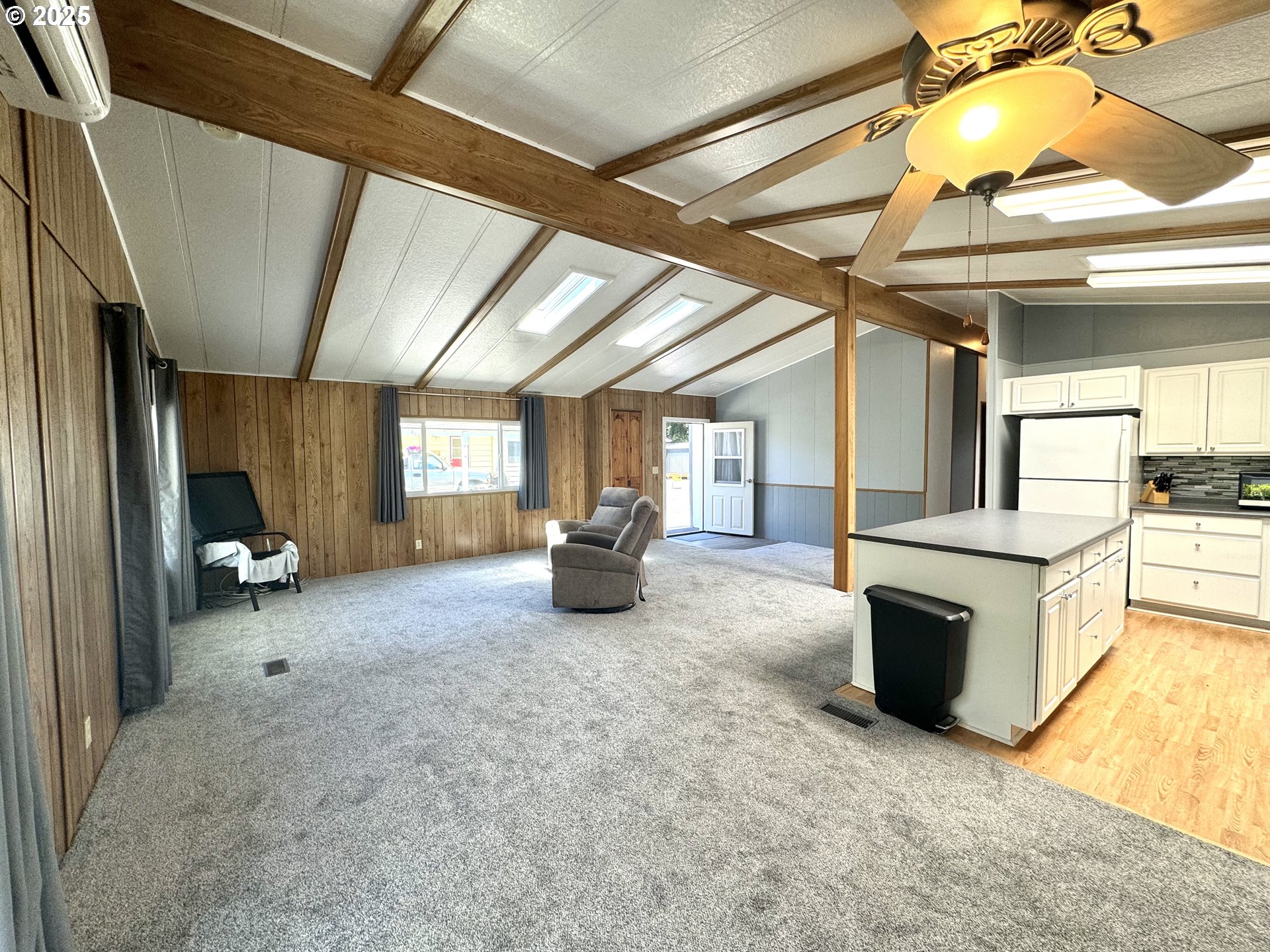 1601 Rhododendron Drive, Unit 676 Florence, OR 97439 - Photo 8 of 36 a room with furniture and a fireplace