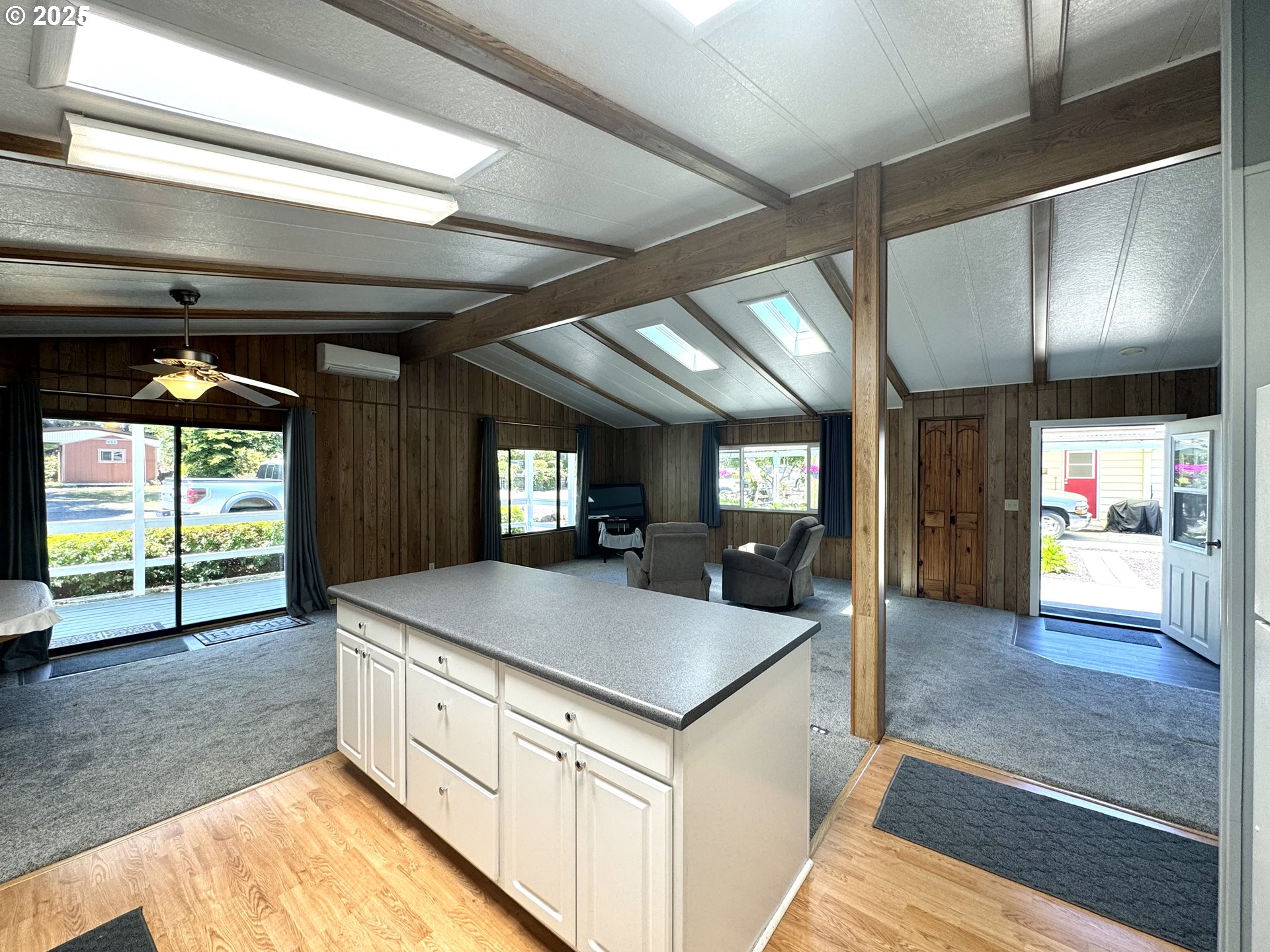 1601 Rhododendron Drive, Unit 676 Florence, OR 97439 - Photo 9 of 36 a kitchen with stainless steel appliances granite countertop a sink and a stove