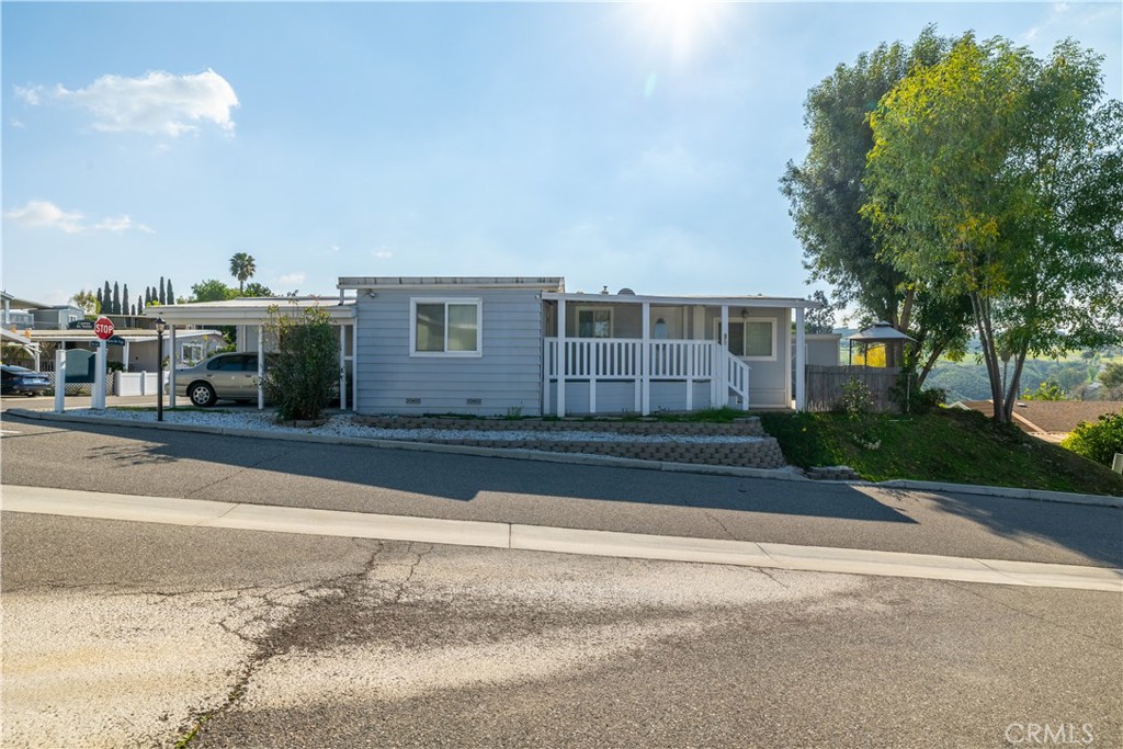 15181 Van Buren, Unit 90 Riverside, CA 92504 - Photo 26 of 27 a view of a house with a yard