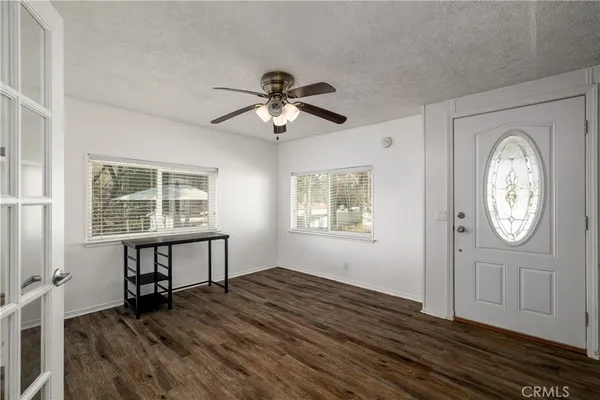a view of workspace with wooden floor ceiling fan